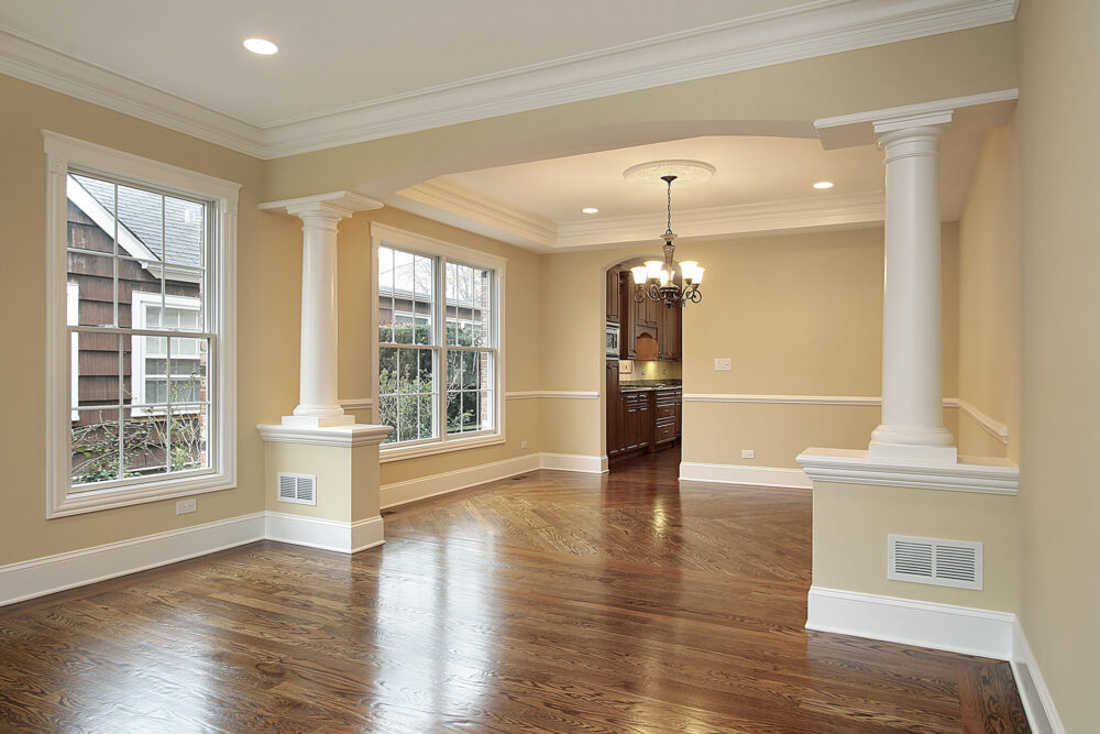 Living and dining room with white pillars