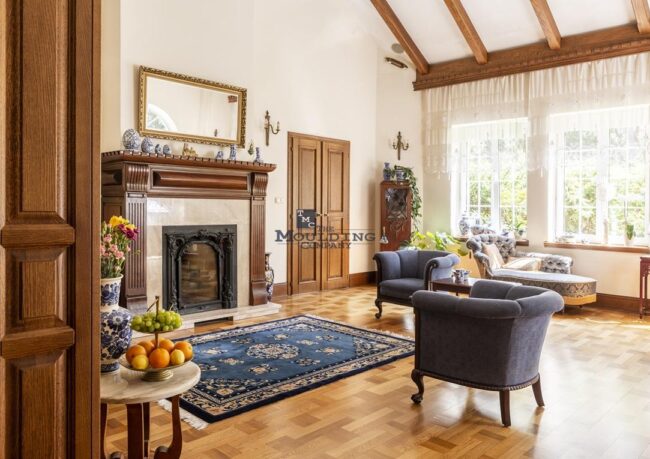 Close-up of natural wood moulding installed along a wall for a warm, finished look