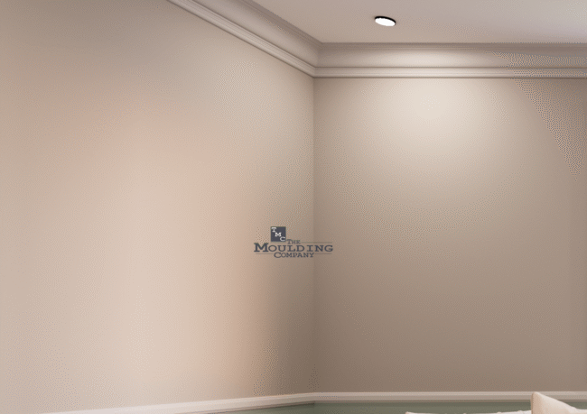 Elegant white crown moulding installed along a living room ceiling for a finished, classic look