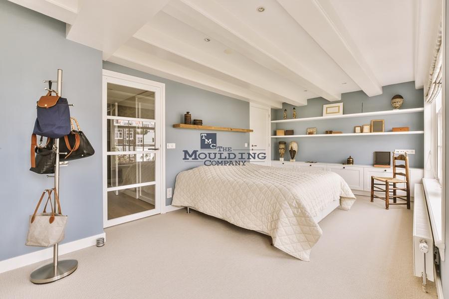 Bedroom design with baseboard and crown