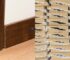 Comparison of MDF trim and wood trim installed on baseboards and crown moulding in a finished interior