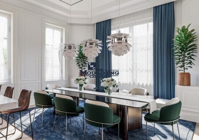 Living room and dining area with coordinated baseboards, crown moulding, and door casings