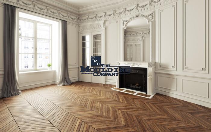 Elegant interior with ornate wall moldings and hardwood flooring.