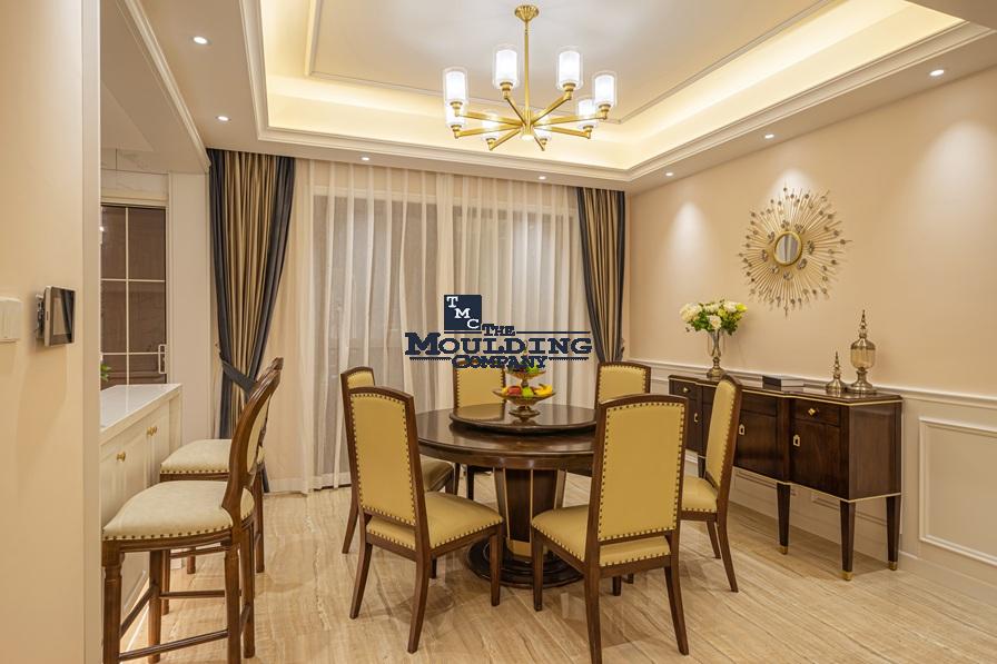 Elegant dining room with custom moldings and modern decor.