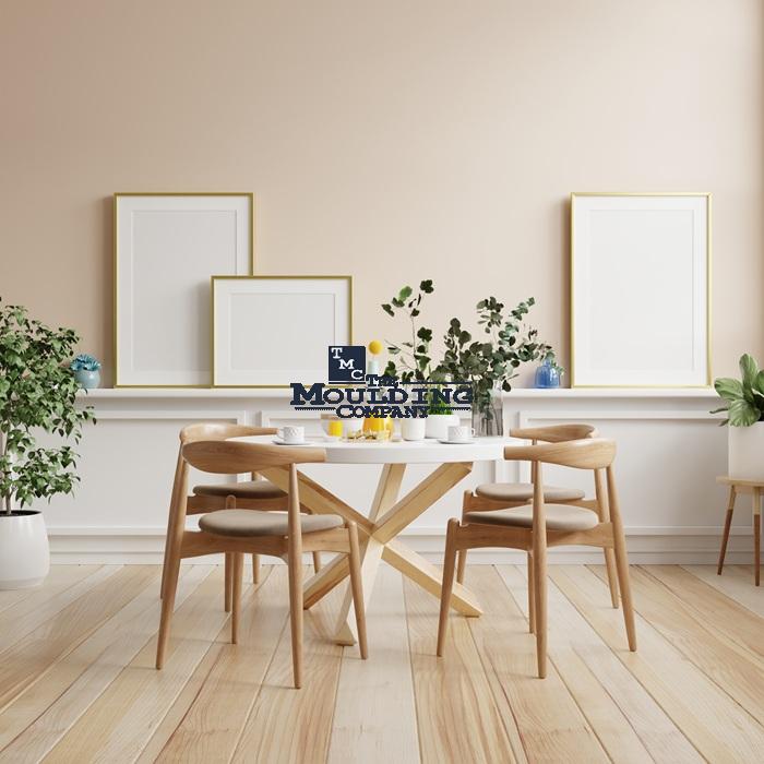 Modern dining room with moulding accents and minimalist decor.