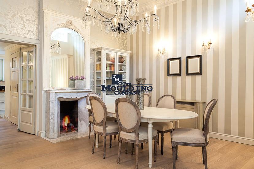 High-quality decorative molding and trim accents in a sophisticated dining room setting.