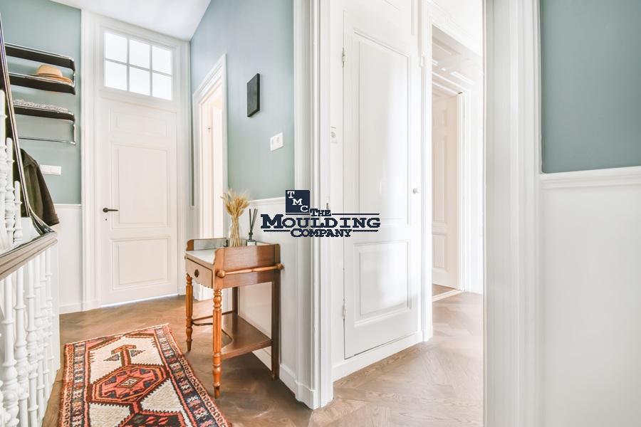 Entrance hall with decorative mouldings and classic design.