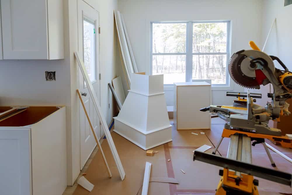 Interior view of a woodworking workshop with molding materials and tools.