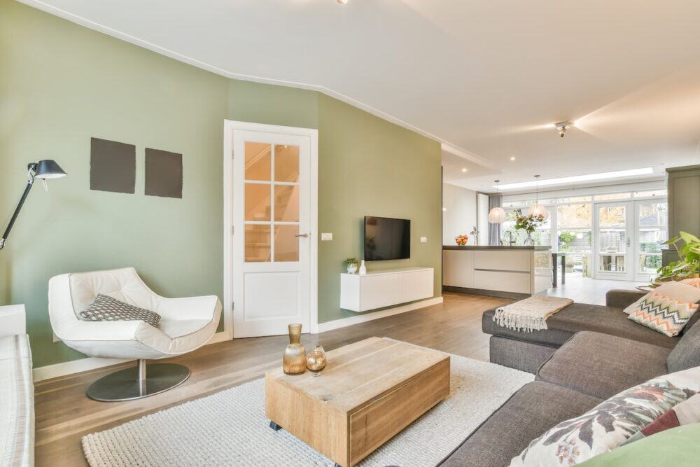 Spacious living room with stylish moulding and contemporary furniture.
