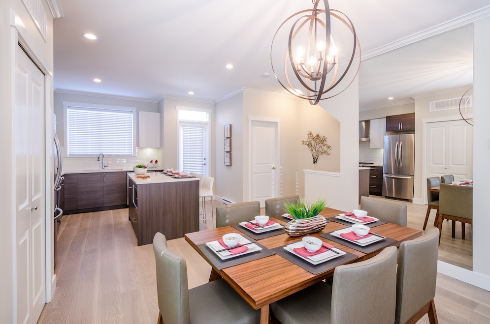 Spacious modern kitchen and dining room with contemporary decor.