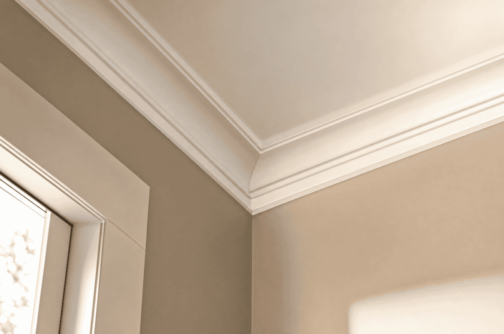 Built-up interior cornice made from three stacked moulding profiles at a ceiling line