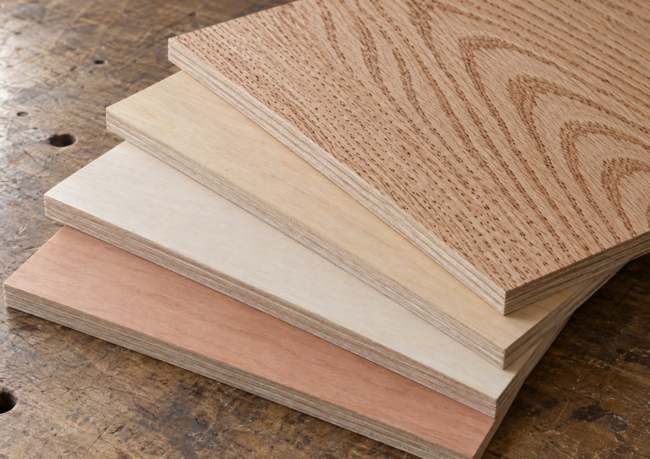 Stacked sheet goods including luan plywood, MDF and hardwood plywood panels in a lumber yard rack