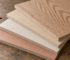 Stacked sheet goods including luan plywood, MDF and hardwood plywood panels in a lumber yard rack