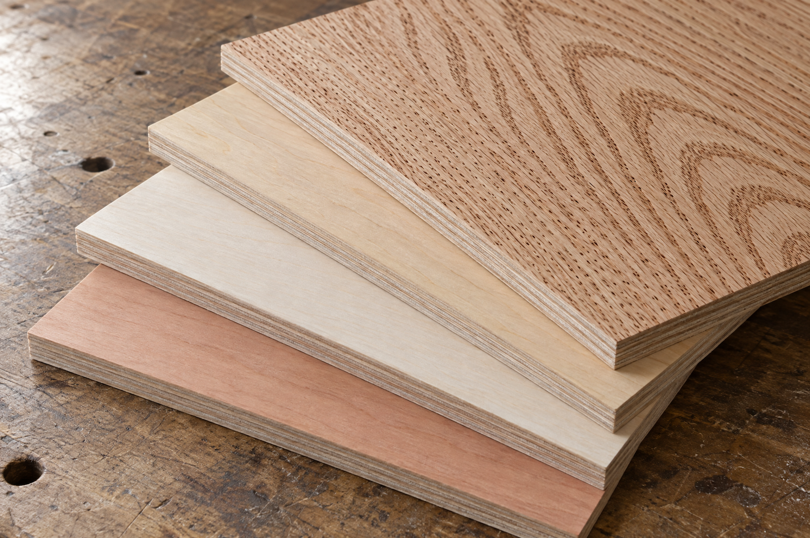 Stacked sheet goods including luan plywood, MDF and hardwood plywood panels in a lumber yard rack
